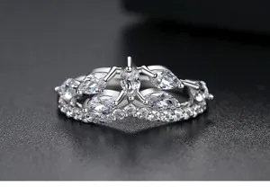 Macro view of silver plated crown ring set with marquise and round zircon stones