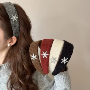 Elegant plush padded headband with rhinestone snowflake embellishment in five colors.