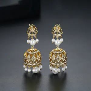 Exquisite vintage Indian Jhumka earrings with gold finish, crystals, and white pearls.