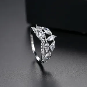 Elegant silver crown ring with marquise-cut zircon stones on a professional black background