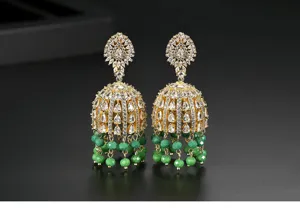 Detailed view of vintage Indian style Jhumka earrings with CZ stones and green beads