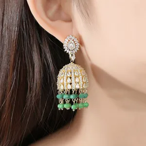 Elegant Indian style Jhumka bell dangle earrings with green beads and cubic zirconia.