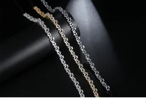 Macro detail of elegant zircon necklaces with black ribbons in gold and silver tones.