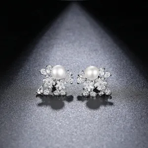 Elegant silver-toned stud earrings with freshwater pearls and sparkling cubic zirconia