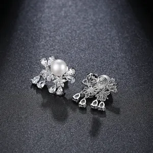 Elegant freshwater pearl stud earrings with sparkling cubic zirconia floral design