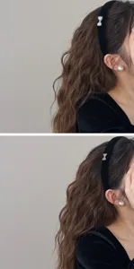 Detail view of a vintage black velvet headband with a sparkling rhinestone bow embellishment.