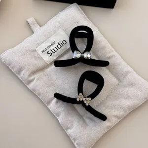 Elegant black velvet hair claw clip set with rhinestone accents for women