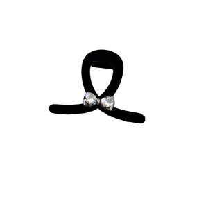 Elegant vintage French black flocked hair claw clip featuring a sparkly rhinestone bow