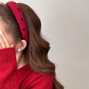 Chic red wide plush headband with heart patterns for a high-top look and hair volume