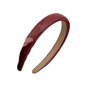 High-gloss wine red patent leather headband featuring a minimalist design for women's hair styling
