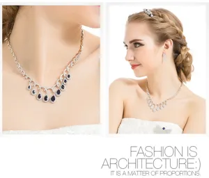 Detailweergave van een elegante bruidssieradenset met blauwe druppelkristallen op een model