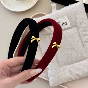 Exquisite black and red velvet headbands with elegant gold bow accents for women