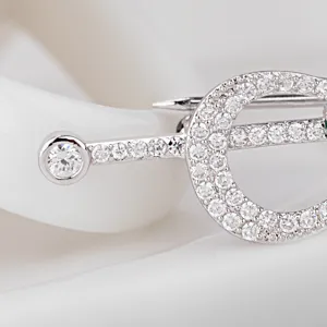 Vintage guitar brooch with CZ micro-pave, elegant silver-toned pin for women.
