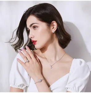 Elegant detail view of a model wearing a luxurious 2ct round sona diamond jewelry set