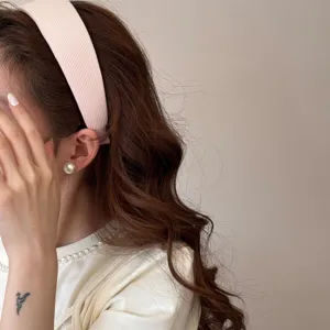 Elegant soft pink wide sponge headband for women featuring high-quality textured fabric