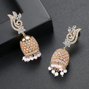 Elegant gold Indian style Jhumka bell earrings with white pearls and sparkling crystals