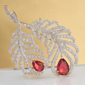 Luxurious vintage feather brooch with red pear-cut zircon and silver-toned finish