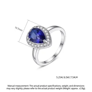 Elegante druppelvormige blauwe zirkoon ring met halo pavé zetting