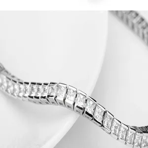 Close-up detail of a sparkly single row square-cut cubic zirconia tennis bracelet
