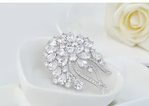 Elegant vintage French style flower brooch featuring sparkling pear-cut cubic zirconia