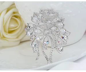 Macro detail showing the back setting of a vintage silver flower brooch with 3A zircons