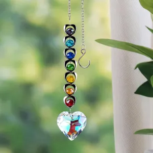 Detailed view of a rainbow maker suncatcher with colorful heart crystals and prism