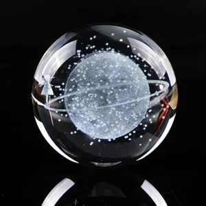 Macro detail of laser-engraved galaxy inside a crystal ball night light ornament