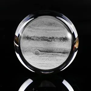 Macro view showing the detailed 3D laser-engraved Jupiter inside a clear crystal ball