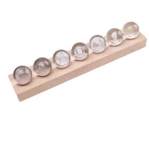 Galaxy crystal ball set on wooden base with 3D laser engraving for bedroom decor.