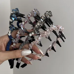 Close-up of multiple luxury crystal headbands with anti-slip teeth in elegant colors