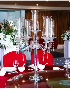 Elegant 5-arm crystal candelabra centerpiece displayed on a festive wedding banquet table