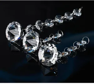 Close-up macro view of faceted octagonal crystal beads chain with brilliant refraction
