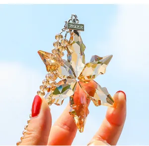 Amber crystal star car pendant detail shot, sparkling facet design with hanging charm.