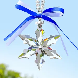 Crystal snowflake car hanging ornament with blue ribbon, sparkling rearview mirror pendant decor.