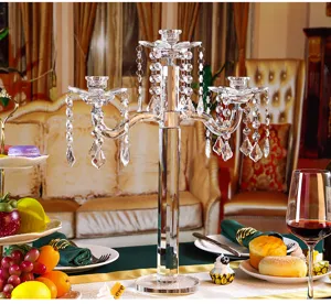 Detail view of five-arm crystal candle holder with lotus holders and hanging beads