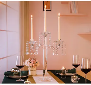 Elegant 5-arm crystal candelabra on a romantic dinner table for wedding decor