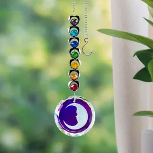 Detailed macro shot of suncatcher crystal prisms and hanging rainbow hearts