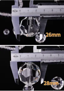 Detailed view of faceted crystal balls showing 26mm and 28mm measurements
