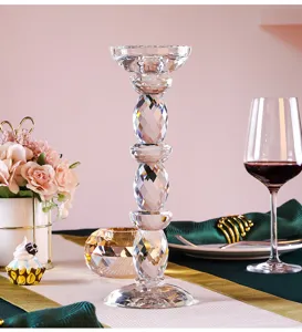 Elegant multifaceted crystal glass candlestick ornament for romantic wedding table decor.