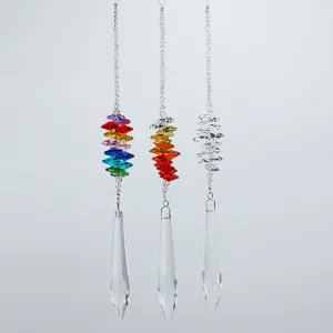 Set of three K9 crystal meteor shower suncatchers with geometric colorful prism pendants.