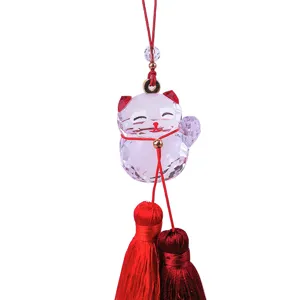 Exquisite faceted crystal lucky cat car hanging ornament featuring dual red silk tassels