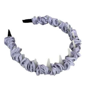 Elegant lavender satin pleated headband with decorative spikes for hair styling.