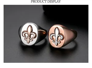 Detailed view of two-tone men's signet rings featuring embossed Fleur-de-lis emblems