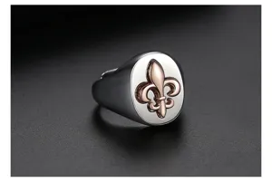 Close-up of vintage fleur-de-lis signet ring with silver and rose gold plating