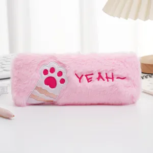 Detailed macro view of pink plush cat paw pencil case with soft fuzzy texture and embroidery