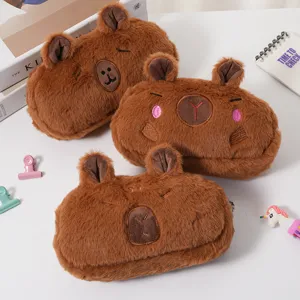 Detailed view of three cute brown plush capybara pencil cases with different facial expressions