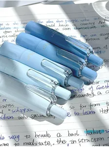 Detailed macro view of five blue gradient correction tapes featuring Good Luck print
