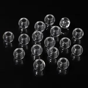 Macro view of crystal clear acrylic round beads with large hole for DIY jewelry