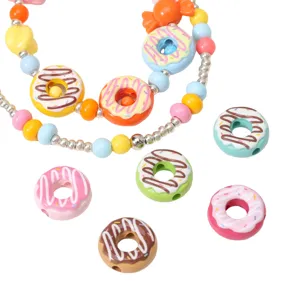 Close-up of colorful 16mm acrylic donut beads for DIY jewelry making and crafts