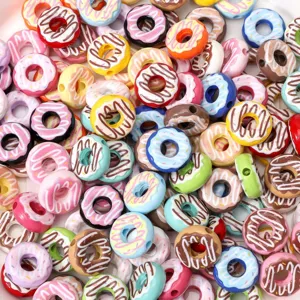 Macro view of assorted colorful 16mm acrylic donut-shaped beads for DIY jewelry crafts